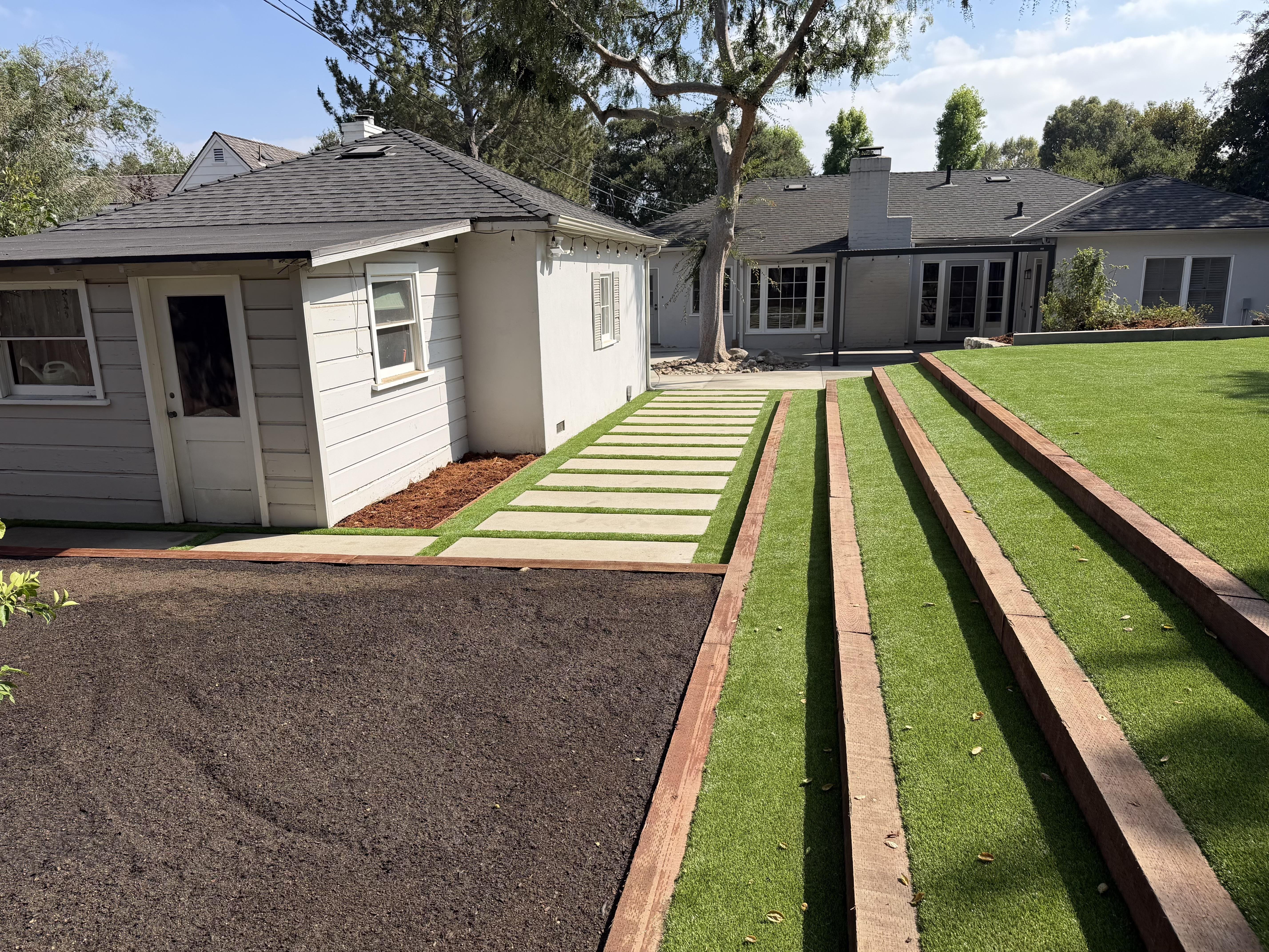 Cleaned up overgrown garden area with dense shrubs, planted and pruned new flowers, mature trees.