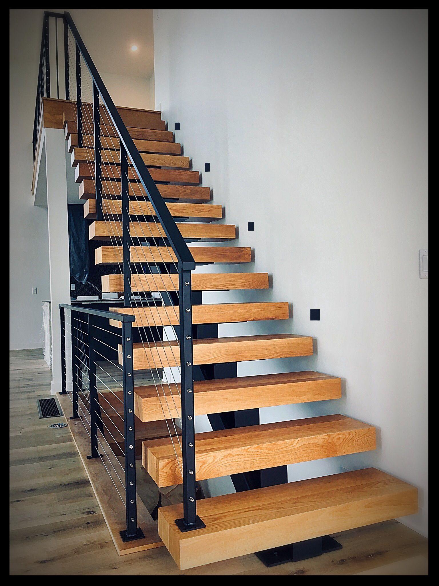 Custom metal stair railing installed on an exterior staircase